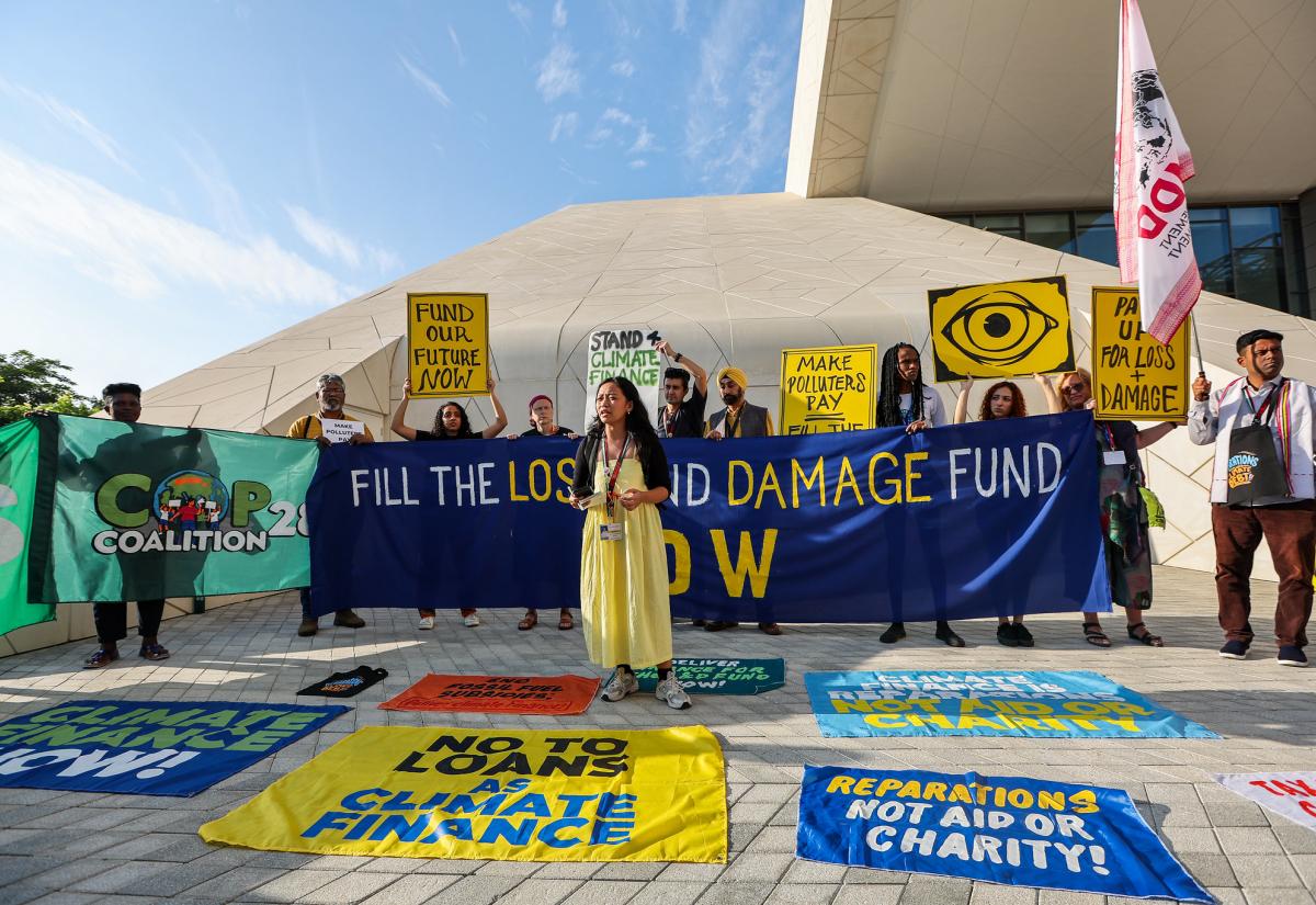 Reparations and Climate Finance Simple Banner holding: Fill the Loss & Damage Fund Now! Action by DIGO BIKAS INSTITUTE during the UN Climate Change Conference COP28 at Expo City Dubai on December 4, 2023, in Dubai, United Arab Emirates.