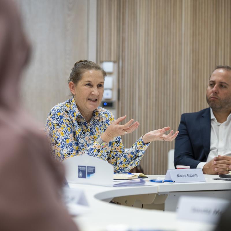 Woman speaks in classroom